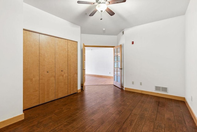 4500 Chicago Ave Unit 103, Minneapolis, MN 55407 - unfurnished bedroom with wood-type flooring, baseboards, and ceiling fan