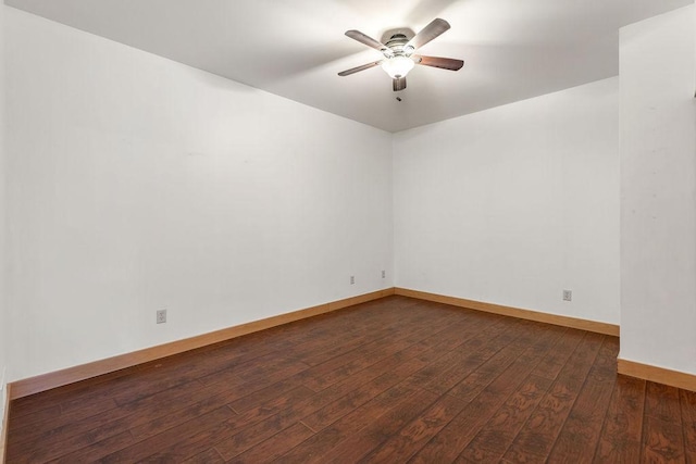 4500 Chicago Ave Unit 103, Minneapolis, MN 55407 - spare room with a ceiling fan, dark wood-type flooring, and baseboards