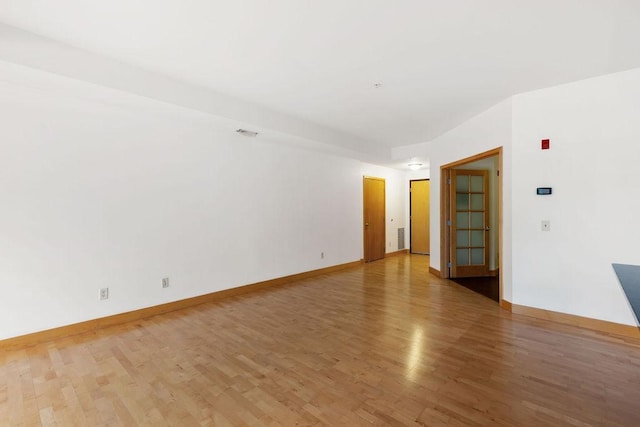 4500 Chicago Ave Unit 103, Minneapolis, MN 55407 - spare room with light wood-style flooring and baseboards