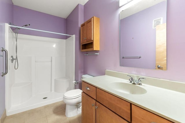 4500 Chicago Ave Unit 103, Minneapolis, MN 55407 - full bath featuring a shower, tile patterned floors, vanity, and toilet