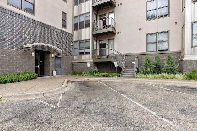 4500 Chicago Ave Unit 103, Minneapolis, MN 55407 - view of apartment building / complex featuring uncovered parking