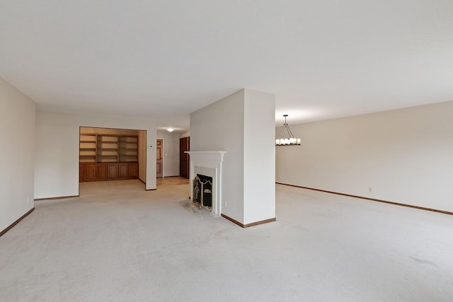 5100 France Ave S Unit 305, Edina, MN 55410 - unfurnished living room featuring light colored carpet, a premium fireplace, baseboards, and a chandelier