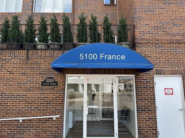 5100 France Ave S Unit 305, Edina, MN 55410 - doorway to property featuring brick siding