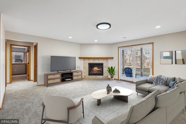20595 Kearney Path, Lakeville, MN 55044 - living room with carpet floors, a tiled fireplace, recessed lighting, and baseboards