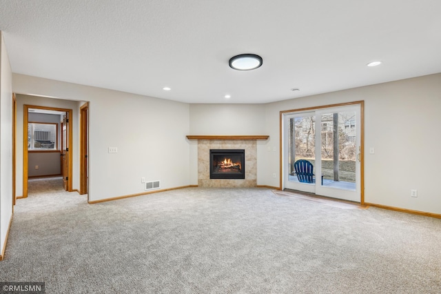 20595 Kearney Path, Lakeville, MN 55044 - unfurnished living room featuring baseboards, carpet floors, a fireplace, and recessed lighting