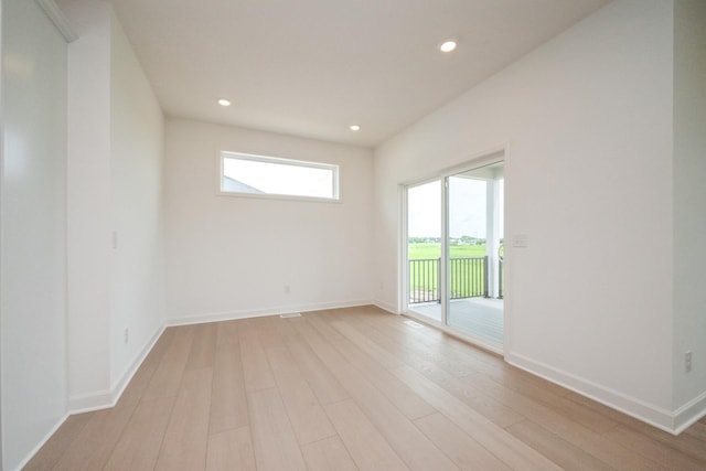 9729 49th St NE, Saint Michael, MN 55376 - empty room featuring light wood-type flooring and recessed lighting