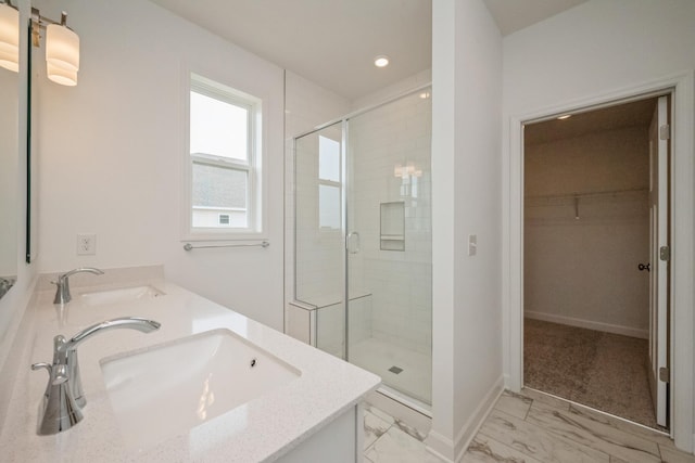 9729 49th St NE, Saint Michael, MN 55376 - full bathroom featuring a shower stall, double vanity, a walk in closet, marble look tile flooring, and recessed lighting
