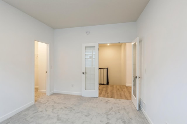 9729 49th St NE, Saint Michael, MN 55376 - unfurnished bedroom with french doors and carpet