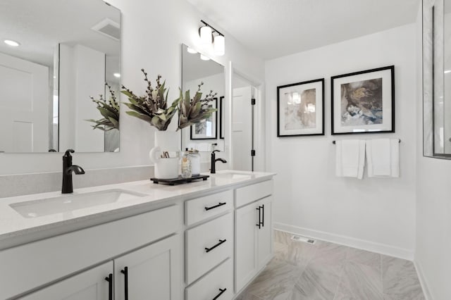 4564 Obsidian Way, Victoria, MN 55386 - bathroom featuring double vanity, marble finish floors, and recessed lighting