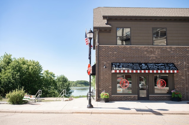 4564 Obsidian Way, Victoria, MN 55386 - view of building exterior with a water view