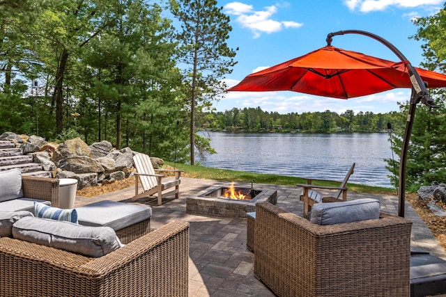 2625 7th Ave, Chetek, WI 54728 - view of patio featuring a fire pit, a water view, and a view of trees