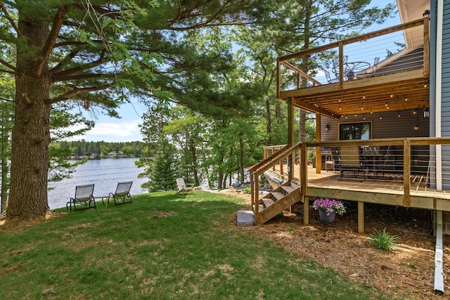 2625 7th Ave, Chetek, WI 54728 - view of green lawn featuring a deck with water view