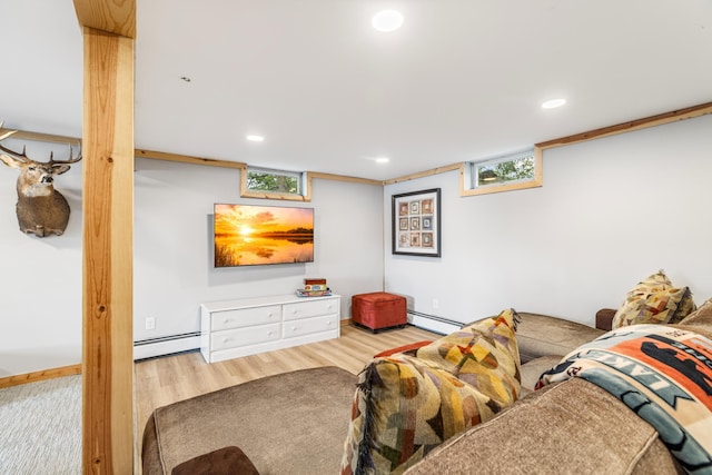 2625 7th Ave, Chetek, WI 54728 - living room featuring baseboard heating, wood finished floors, recessed lighting, baseboards, and plenty of natural light
