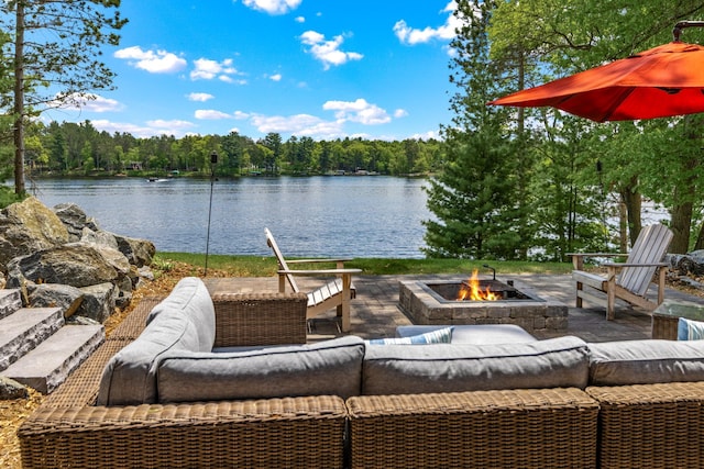 2625 7th Ave, Chetek, WI 54728 - view of patio featuring an outdoor living space with a fire pit, a water view, and a forest view