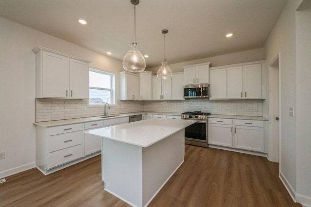 535 Rolling Hills Ln, Delano, MN 55328 - kitchen with stainless steel appliances, dark wood finished floors, white cabinets, light countertops, and recessed lighting