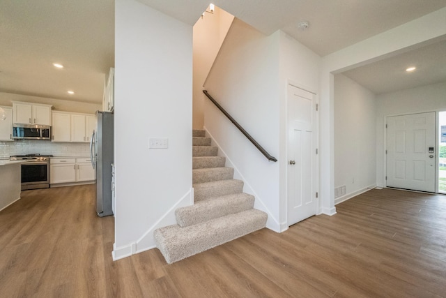 535 Rolling Hills Ln, Delano, MN 55328 - entryway featuring light wood-type flooring, recessed lighting, and stairway