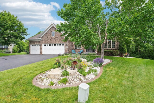 14075 45th Ct NE, Saint Michael, MN 55376 - view of front facade with brick siding, a front lawn, driveway, and an attached garage