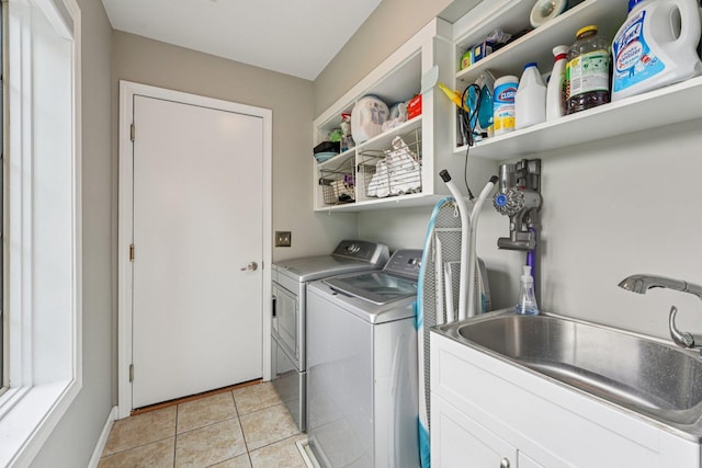 14075 45th Ct NE, Saint Michael, MN 55376 - laundry room featuring independent washer and dryer, light tile patterned floors, and cabinet space