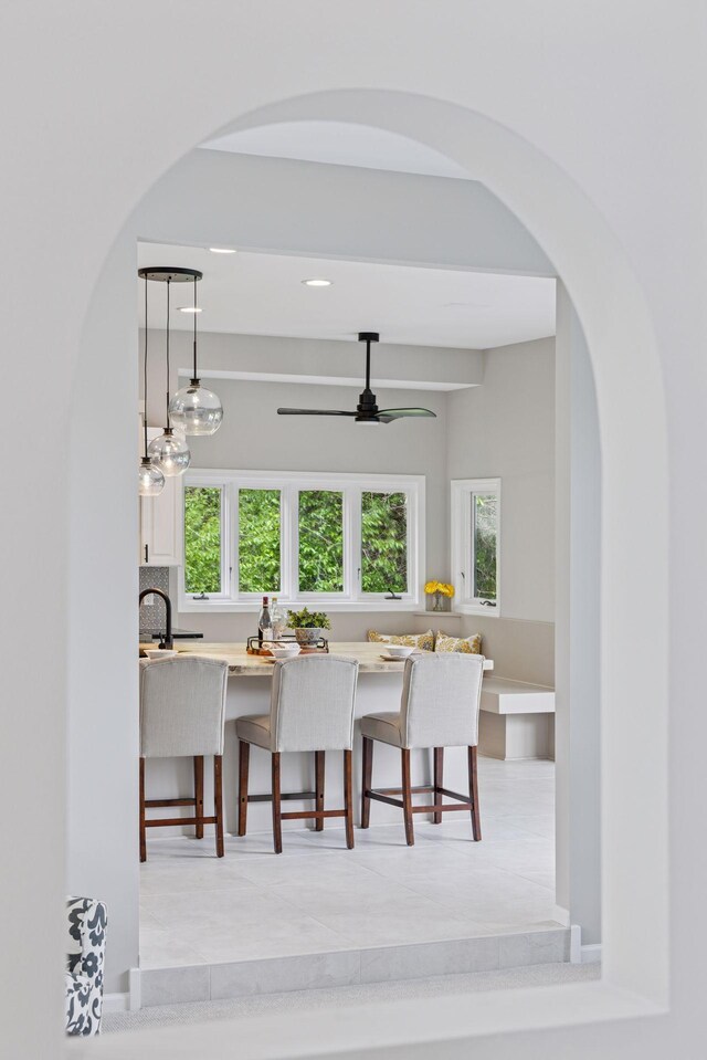 17032 Valley Dr NW, Andover, MN 55304 - dining room featuring arched walkways, healthy amount of natural light, ceiling fan, and recessed lighting