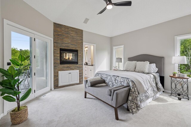17032 Valley Dr NW, Andover, MN 55304 - bedroom with light colored carpet, access to outside, ensuite bathroom, vaulted ceiling, and a ceiling fan