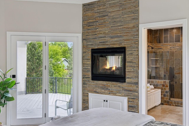 17032 Valley Dr NW, Andover, MN 55304 - bedroom with access to outside, ensuite bath, a multi sided fireplace, and a towering ceiling