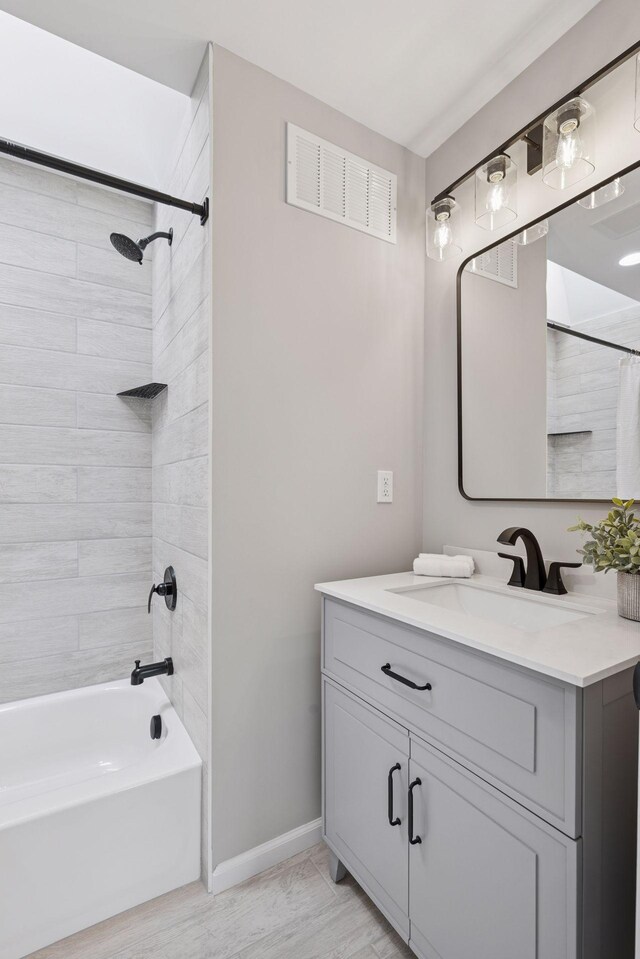 17032 Valley Dr NW, Andover, MN 55304 - bathroom featuring vanity, baseboards, shower / bath combination with curtain, and wood finished floors