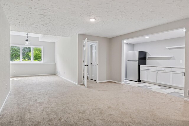 17032 Valley Dr NW, Andover, MN 55304 - unfurnished living room with light colored carpet and baseboards
