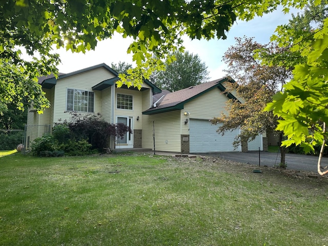 6501 Douglas Dr N, Brooklyn Park, MN 55429 - view of front facade with a garage and driveway