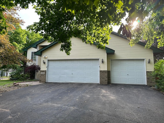 6501 Douglas Dr N, Brooklyn Park, MN 55429 - view of front of home with brick siding and a garage