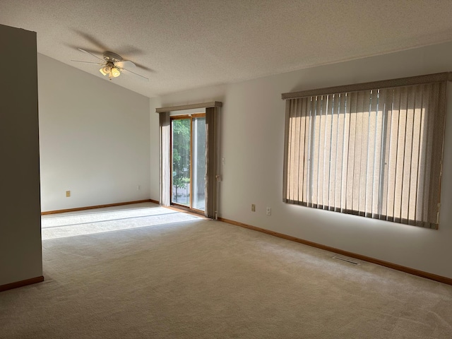 6501 Douglas Dr N, Brooklyn Park, MN 55429 - carpeted empty room featuring a ceiling fan, a textured ceiling, and lofted ceiling