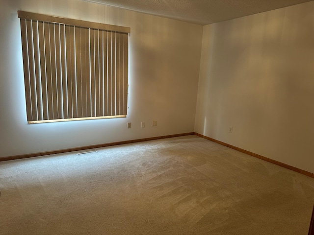 6501 Douglas Dr N, Brooklyn Park, MN 55429 - carpeted empty room featuring baseboards