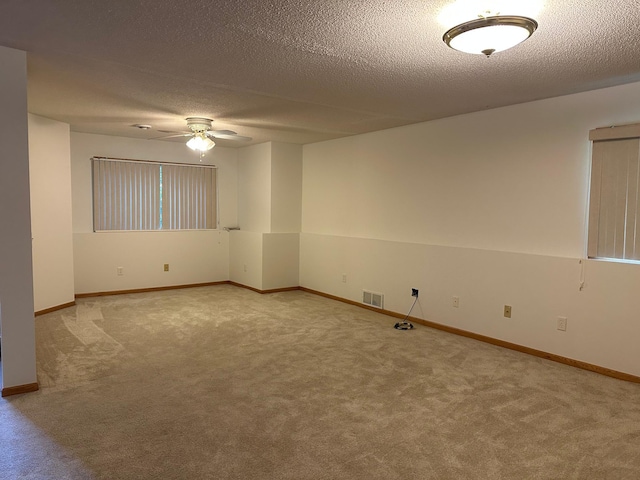 6501 Douglas Dr N, Brooklyn Park, MN 55429 - carpeted empty room with ceiling fan and a textured ceiling