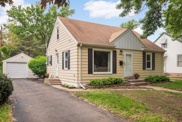 3350 Virginia Ave S, Saint Louis Park, MN 55426 - bungalow-style home featuring an outdoor structure, a garage, board and batten siding, and roof with shingles