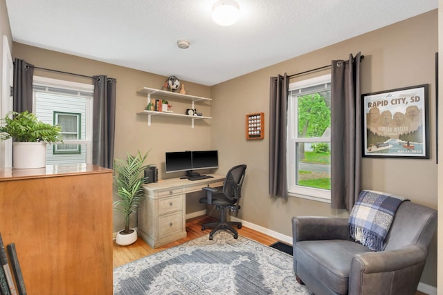 3350 Virginia Ave S, Saint Louis Park, MN 55426 - office area with light wood-type flooring, baseboards, and a textured ceiling