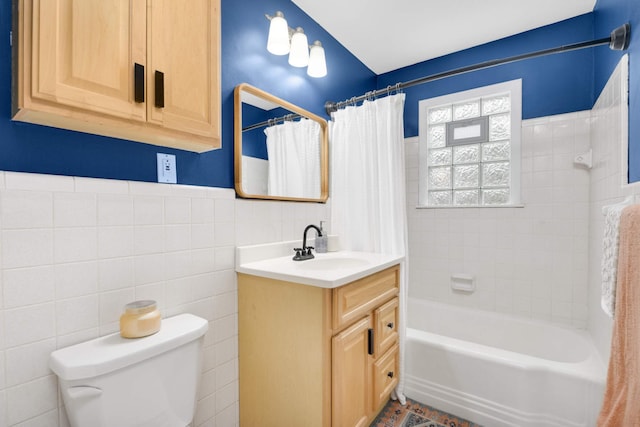 3350 Virginia Ave S, Saint Louis Park, MN 55426 - full bathroom featuring tile walls, vanity, toilet, and shower / tub combo
