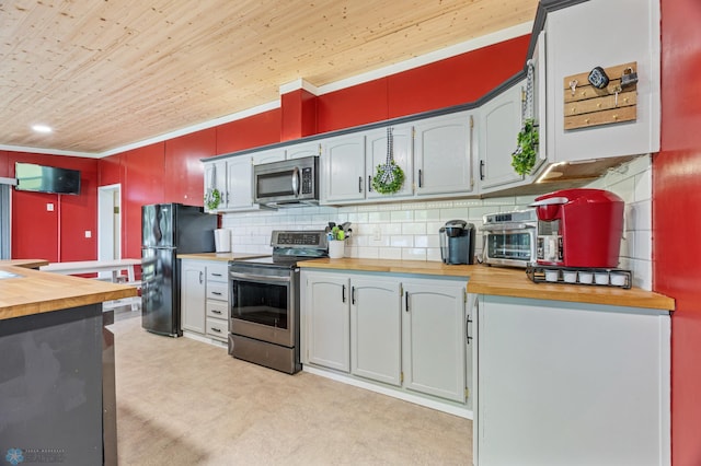3022 Sandy Beach Rd, Hatton, ND 58240 - kitchen featuring stainless steel appliances, butcher block counters, decorative backsplash, wood ceiling, and light floors