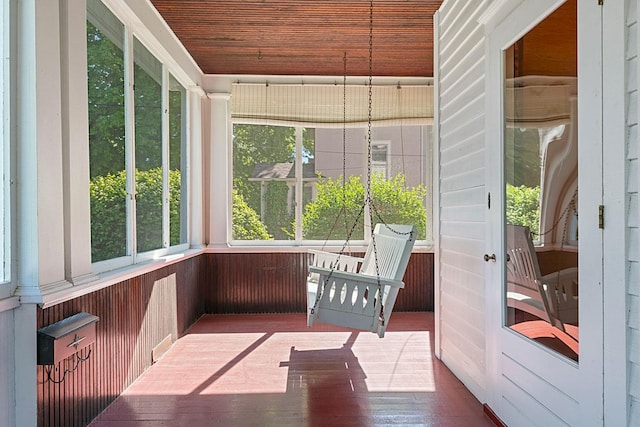 408 5th St E, Northfield, MN 55057 - unfurnished sunroom featuring healthy amount of natural light, wood ceiling, and wooden walls