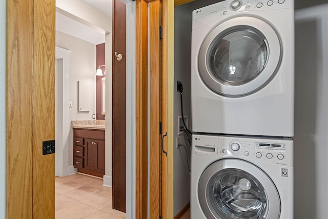 408 5th St E, Northfield, MN 55057 - laundry area featuring stacked washer / drying machine and light tile patterned floors