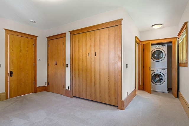 408 5th St E, Northfield, MN 55057 - laundry room with stacked washer and clothes dryer and carpet