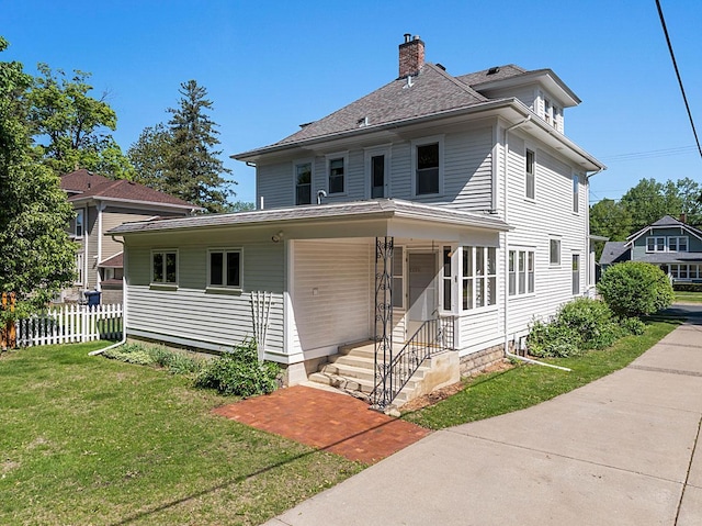 408 5th St E, Northfield, MN 55057 - traditional style home featuring a chimney, roof with shingles, and covered porch