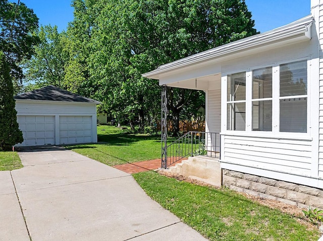 408 5th St E, Northfield, MN 55057 - view of grassy yard featuring a garage and an outbuilding