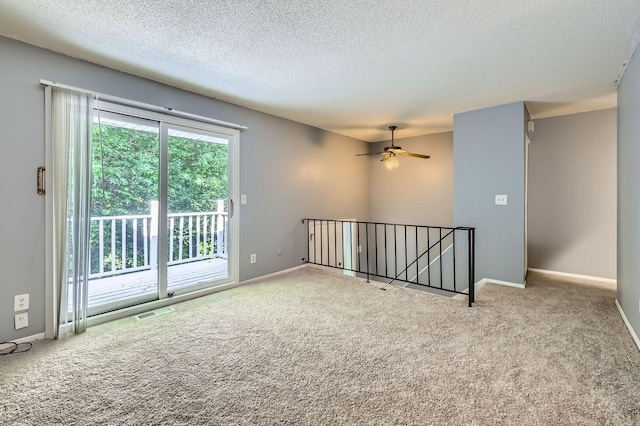 3944 76th Way E, Inver Grove Heights, MN 55076 - carpeted spare room featuring a textured ceiling, ceiling fan, and baseboards