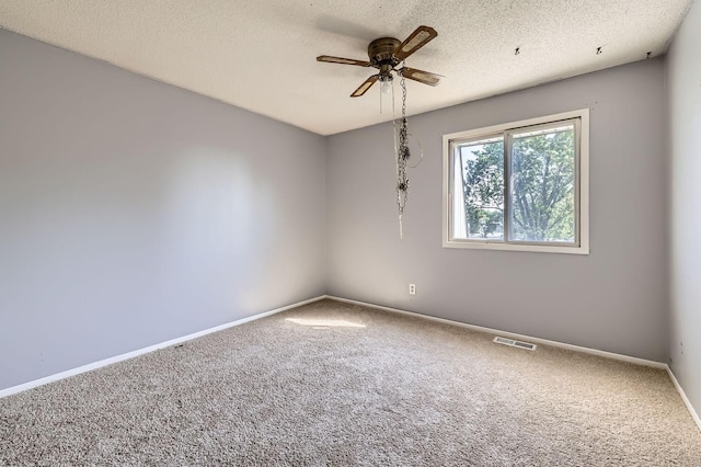 3944 76th Way E, Inver Grove Heights, MN 55076 - spare room featuring carpet, a ceiling fan, baseboards, and a textured ceiling