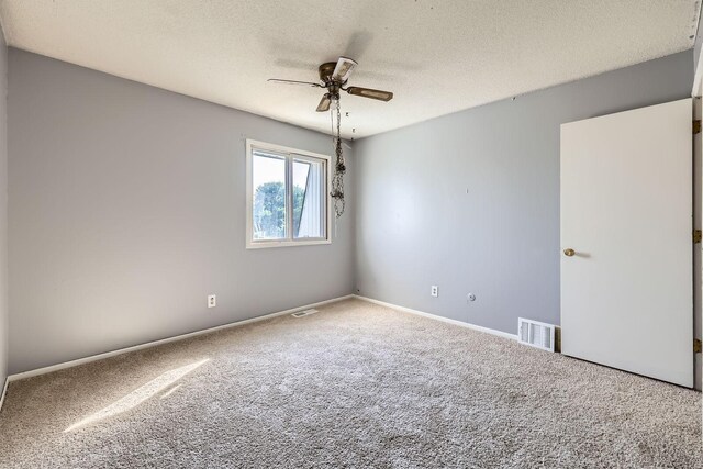 3944 76th Way E, Inver Grove Heights, MN 55076 - carpeted empty room with a ceiling fan, a textured ceiling, and baseboards