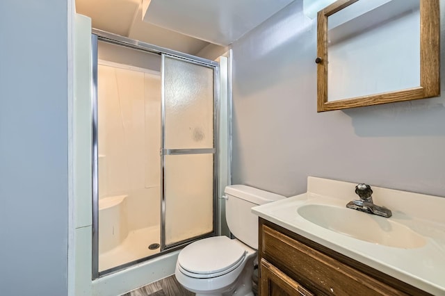3944 76th Way E, Inver Grove Heights, MN 55076 - bathroom with a shower stall, toilet, and vanity