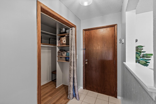 2200 Nevada Ave S Unit 320, Saint Louis Park, MN 55426 - entryway with a textured ceiling and light wood-style floors