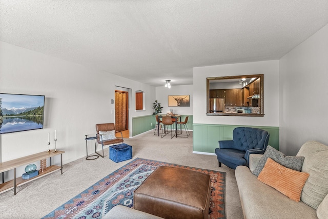 2200 Nevada Ave S Unit 320, Saint Louis Park, MN 55426 - living room featuring carpet floors, a textured ceiling, and a wainscoted wall