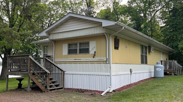 26302 Lakeview Dr, Comfort Twp, MN 55051 - manufactured / mobile home featuring a front yard and stairway