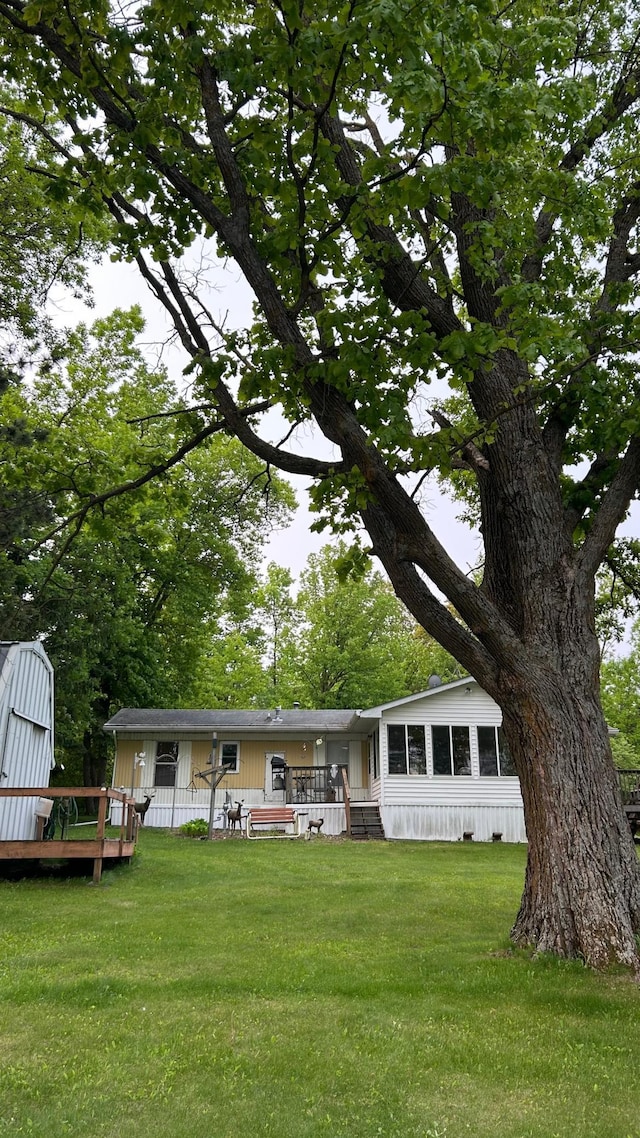 26302 Lakeview Dr, Comfort Twp, MN 55051 - back of property with a yard and a wooden deck