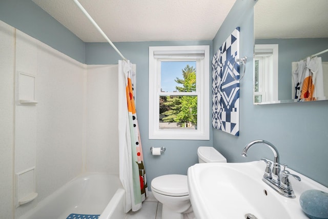 2934 Natchez Ave S, Saint Louis Park, MN 55416 - full bathroom featuring a sink, shower / bath combination with curtain, a textured ceiling, toilet, and tile patterned flooring